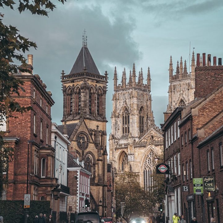 York Minster scene View of York Minster surrounded by historic buildings and a cloudy sky.